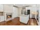 Modern kitchen features white cabinets, granite countertops, and a cozy fireplace at 4217 Wieuca Overlook Ne, Atlanta, GA 30342