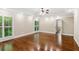 Expansive main bedroom with tray ceiling, hardwood flooring, and plantation shutters at 4217 Wieuca Overlook Ne, Atlanta, GA 30342