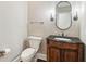 Charming powder room featuring an elegant vanity, mirror, and fixtures for guests' convenience at 4217 Wieuca Overlook Ne, Atlanta, GA 30342