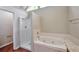 Bathroom featuring a standalone shower and a tub with jets for relaxation at 616 Lone Oak Ct, Lithonia, GA 30058