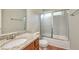 Bathroom featuring a granite countertop, white sink, and sliding shower door at 616 Lone Oak Ct, Lithonia, GA 30058