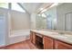 Bathroom featuring granite counters, white cabinets, and a triangular window at 616 Lone Oak Ct, Lithonia, GA 30058