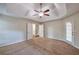 Bedroom featuring neutral walls, carpet floors, ceiling fan, and access to the back at 616 Lone Oak Ct, Lithonia, GA 30058