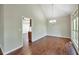 Bright dining room with a modern chandelier and natural light, ideal for hosting dinners at 616 Lone Oak Ct, Lithonia, GA 30058