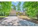 Charming single-story home featuring a well-maintained lawn, mature trees, and an attached two-car garage at 616 Lone Oak Ct, Lithonia, GA 30058