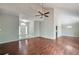 Open-concept living area with a fireplace, vaulted ceilings, and a seamless transition to the dining space at 616 Lone Oak Ct, Lithonia, GA 30058