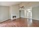 Spacious living area with a fireplace, high ceilings, and a bright entrance creates a welcoming atmosphere at 616 Lone Oak Ct, Lithonia, GA 30058