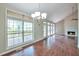 Bright living room boasting wood floors, vaulted ceilings, and large windows for natural light with deck access at 616 Lone Oak Ct, Lithonia, GA 30058