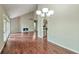 Bright living room featuring wood floors, a fireplace, and vaulted ceilings, creating a warm and inviting atmosphere at 616 Lone Oak Ct, Lithonia, GA 30058