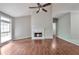 Inviting living room with a fireplace, large window with natural light, and hardwood flooring at 616 Lone Oak Ct, Lithonia, GA 30058