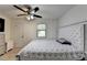 Comfortable bedroom featuring a plush bed, natural lighting, and closet at 1358 Millstream Trl, Lawrenceville, GA 30044