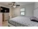 Well-lit bedroom featuring a bed and a window offering natural light at 1358 Millstream Trl, Lawrenceville, GA 30044