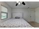 Bright bedroom featuring natural light, a bed with a plush headboard at 1358 Millstream Trl, Lawrenceville, GA 30044