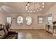 Bright living room features hardwood floors, unique windows, and stylish decor at 1358 Millstream Trl, Lawrenceville, GA 30044