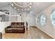 Inviting living room with hardwood floors and staircase to the second level at 1358 Millstream Trl, Lawrenceville, GA 30044