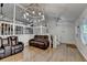 Open-concept living room with hardwood floors and staircase to the second level at 1358 Millstream Trl, Lawrenceville, GA 30044