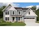 Charming two-story home with stylish gray siding, stone accents, and a welcoming two-car garage at 201 Pickens Bluff Ln, Hiram, GA 30141