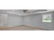 Basement area featuring a ceiling fan, recessed lighting, a bright window providing natural light, and neutral décor at 2592 River Oak Dr, Decatur, GA 30033