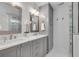Bright, spacious bathroom boasts double vanities and glass enclosed shower at 2592 River Oak Dr, Decatur, GA 30033