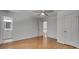 Bedroom view showing hardwood floors, a bathroom, doors, and a ceiling fan at 2592 River Oak Dr, Decatur, GA 30033