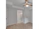 Spacious bedroom with wood floor, fan, and doorway to tiled bathroom at 2592 River Oak Dr, Decatur, GA 30033