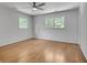 Spacious bedroom featuring hardwood floors, natural light from windows and a ceiling fan at 2592 River Oak Dr, Decatur, GA 30033