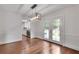 Elegant dining room with hardwood floors, modern chandelier, and access to the kitchen at 2592 River Oak Dr, Decatur, GA 30033