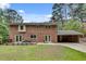 The home's backyard features a brick exterior, deck, patio, and covered carport at 2592 River Oak Dr, Decatur, GA 30033