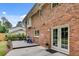 Brick house exterior has a patio and deck that offer views of the lush backyard at 2592 River Oak Dr, Decatur, GA 30033