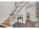 Bright foyer with hardwood stairs, tiled floors, and classic white trim at 2592 River Oak Dr, Decatur, GA 30033