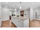 Open-concept kitchen and living room area, complete with an island and stainless steel appliances at 2592 River Oak Dr, Decatur, GA 30033