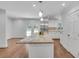 Open kitchen and living area featuring a large island, stainless appliances, and access to the backyard at 2592 River Oak Dr, Decatur, GA 30033