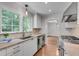 Well-lit kitchen with granite countertops, stainless appliances, and large window over the sink at 2592 River Oak Dr, Decatur, GA 30033