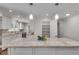 Open kitchen offers granite counters, a large island and ample pantry storage space at 2592 River Oak Dr, Decatur, GA 30033
