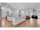 Open concept design with kitchen island leading to a living area featuring hardwood floors at 2592 River Oak Dr, Decatur, GA 30033