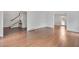 Open-concept living room with hardwood floors and freshly painted white walls at 2592 River Oak Dr, Decatur, GA 30033