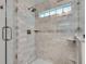Beautiful bathroom showcases a tiled shower with glass door and built in shelving at 2592 River Oak Dr, Decatur, GA 30033