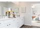 Stylish bathroom with double vanity, white cabinets, and view into the bedroom at 417 Newland Way, Acworth, GA 30102