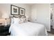 Bedroom featuring natural light, neutral decor, and a comfortable bed creating a serene retreat at 417 Newland Way, Acworth, GA 30102
