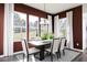 Elegant dining room with large windows, stylish decor, and a modern light fixture at 417 Newland Way, Acworth, GA 30102