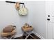 Cozy foyer area with decorative stools, wall hooks, and stylish accessories creating a welcoming entrance at 417 Newland Way, Acworth, GA 30102