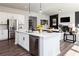 Bright kitchen featuring a large island, stainless appliances, and an open-concept design at 417 Newland Way, Acworth, GA 30102