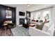 Cozy living room with a stylish fireplace, chic decor, and comfortable seating, perfect for relaxation at 417 Newland Way, Acworth, GA 30102