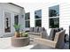 Inviting patio featuring stylish outdoor seating and a modern coffee table at 417 Newland Way, Acworth, GA 30102
