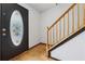 Entryway featuring hardwood flooring and a staircase at 475 Shadetree Ln, Lawrenceville, GA 30044