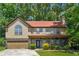 Charming two-story home featuring a covered front porch, attached garage and well-maintained landscaping at 475 Shadetree Ln, Lawrenceville, GA 30044