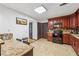 Kitchen area features granite countertops, tiled floor, and eat-in breakfast bar at 475 Shadetree Ln, Lawrenceville, GA 30044