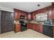 Kitchen features granite countertops, custom cabinetry, and modern appliances at 475 Shadetree Ln, Lawrenceville, GA 30044