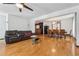 Spacious living room features hardwood flooring and a view into the dining area at 475 Shadetree Ln, Lawrenceville, GA 30044