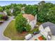 Aerial view of the home, surrounded by lush greenery, a well-manicured lawn, and a spacious driveway at 600 Oakmont Hl, Duluth, GA 30097